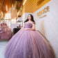 Vestido de quinceañera rosa con lila y pedrería bordada