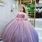 Vestido de quinceañera rosa con lila y pedrería bordada