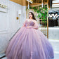 Vestido de quinceañera rosa con lila y pedrería bordada